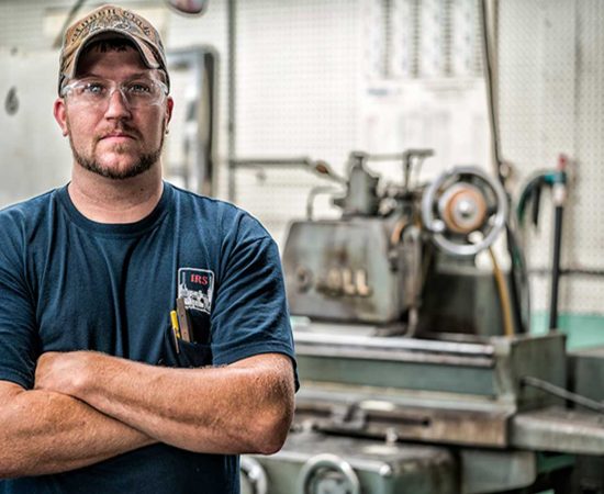 Grace Manufacturing Employee with Arms Crossed